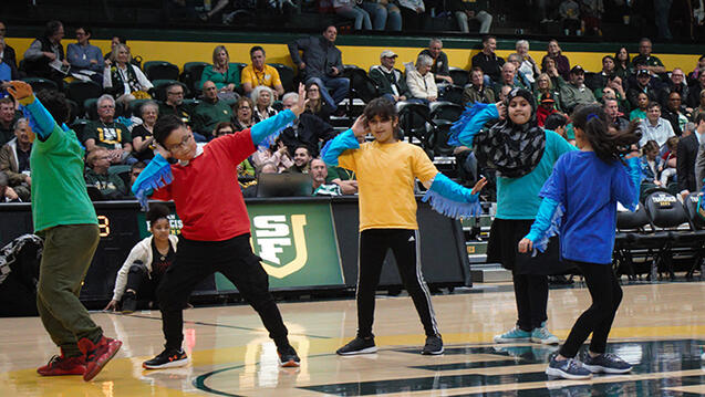 western addition youth perform at usf sports event