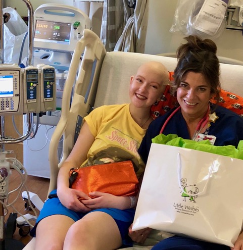 Nurse in a hospital bed with a child