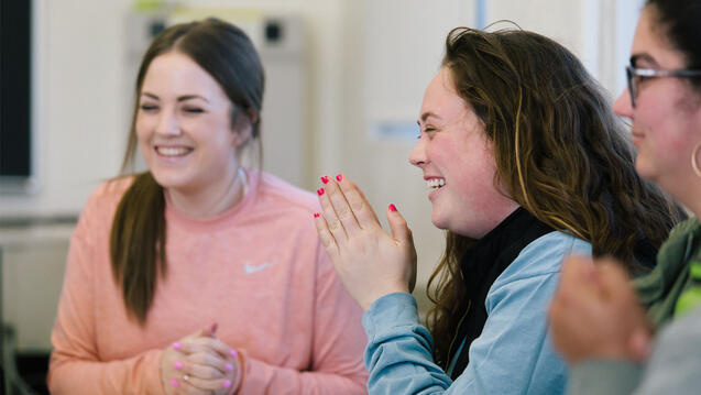 Students laughing in classroom