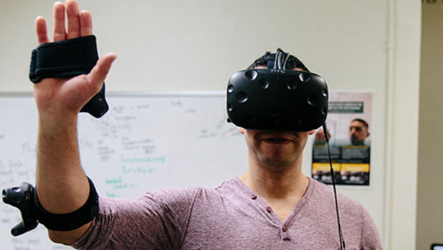 Student in lab wears a virtual reality control unit