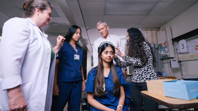 CNAIL team testing brain monitoring device