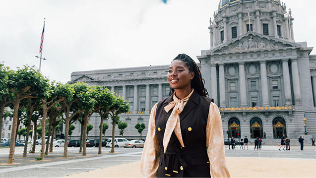 USF law student walking in front of San Francisco city hall