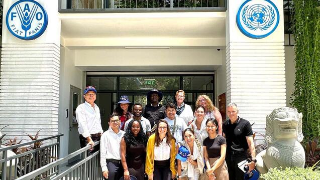 Students posing in front of UNFAO building