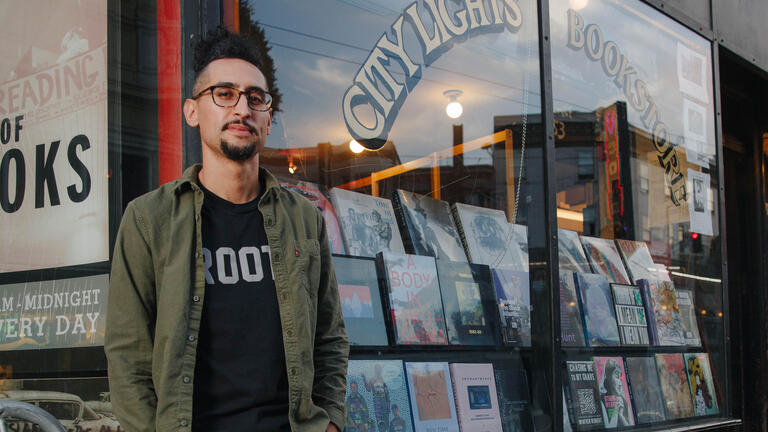 Alan Chazaro in front of City Light Books