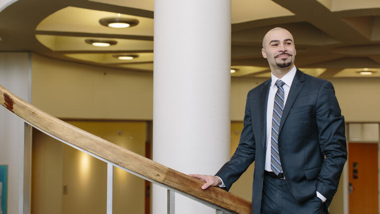 Student standing on staircase