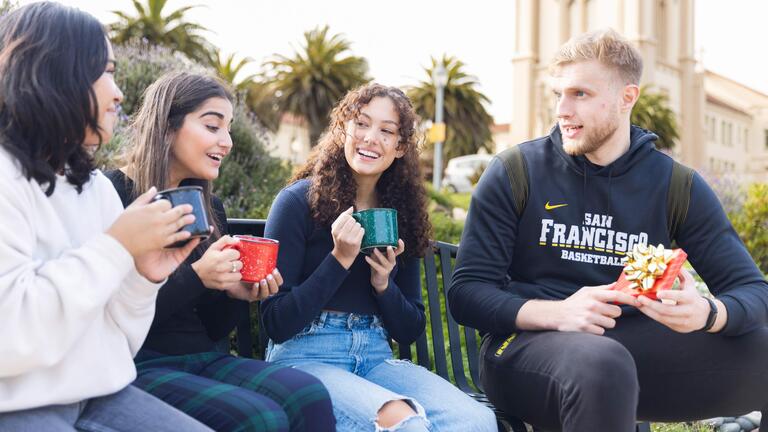 Students talking while sitting outside