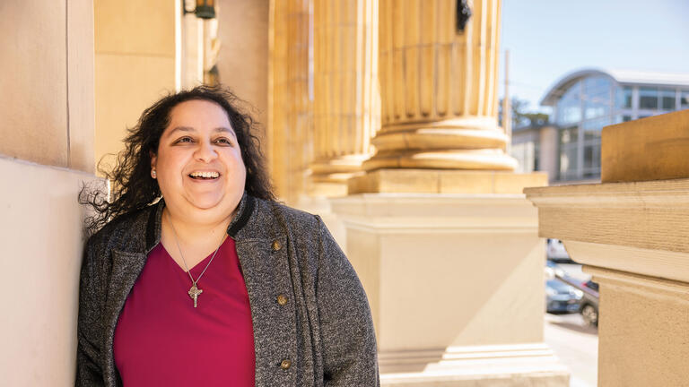 Woman smiling in front of St Ignatius church