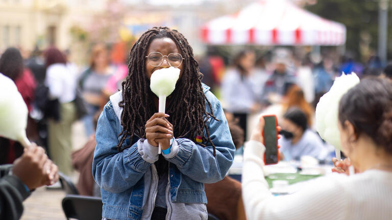 student eating cotton candy