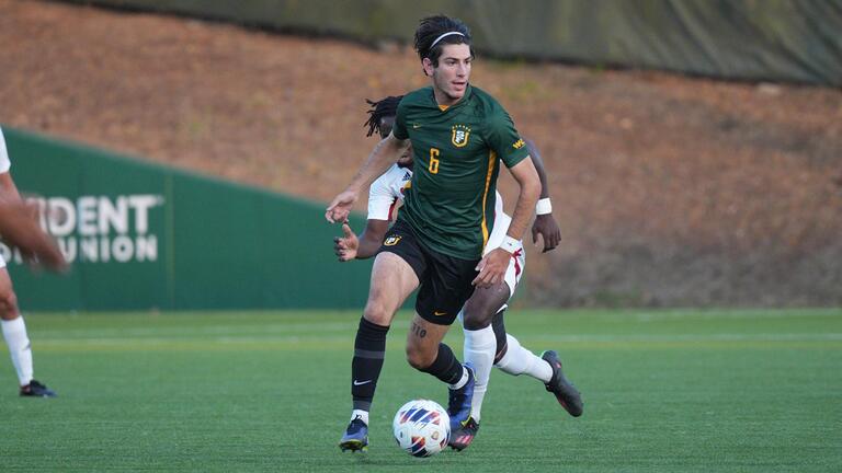 usf soccer player running with ball