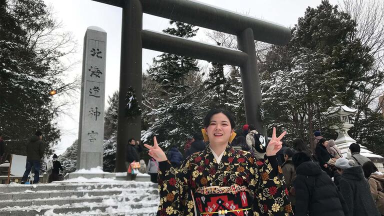 Amanda Tsuhako standing in front of a Japanese shrine