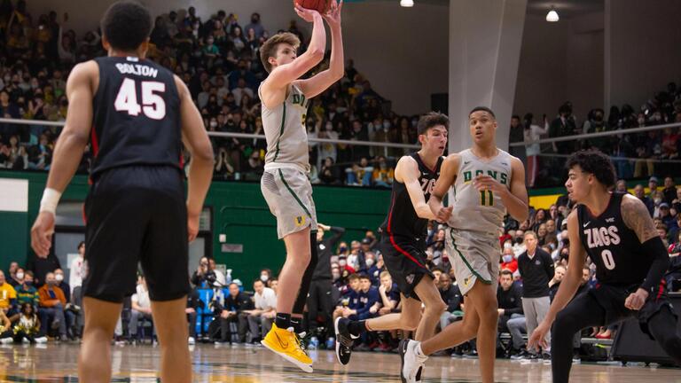 basketball player jumping in air