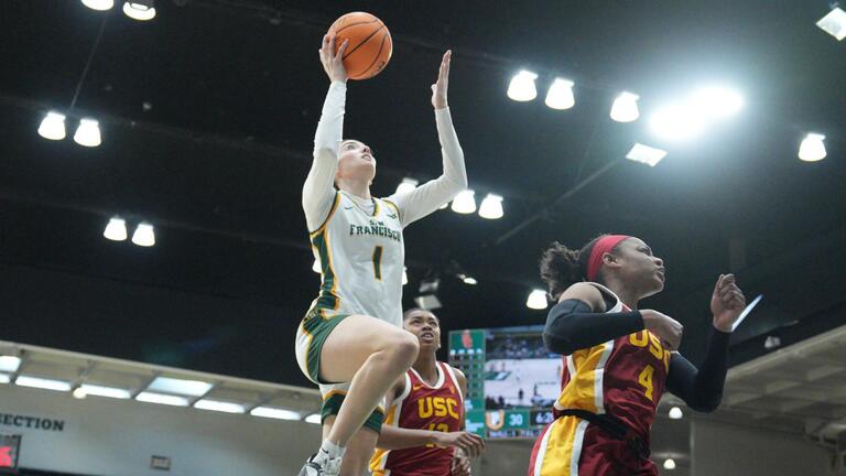 USF women&#039;s basketball player takes a shot.