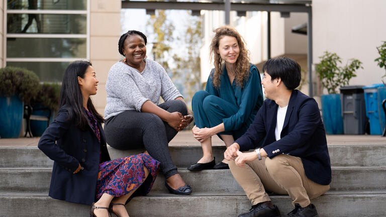 Students sitting on steps chatting