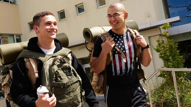 ROTC student in full gear walking through campus