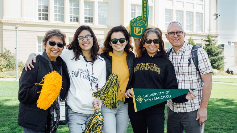 family with a lot of school spirt dropping off their daughter at USF