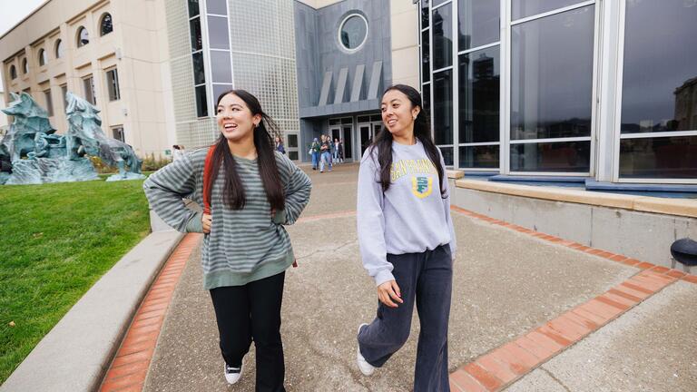 Two USF students walking on campus together