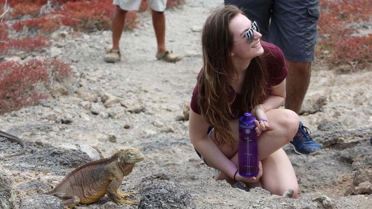 Student with an iguana