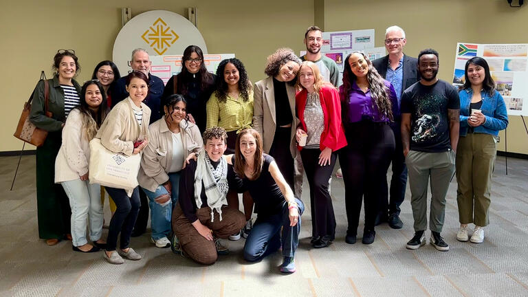 International Studies students, faculty, and staff at the spring capstone poster presentation.