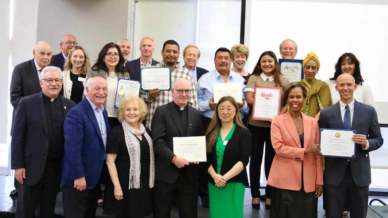 People holding certificates