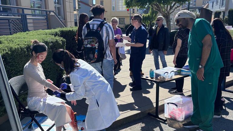 Student helping an injured person