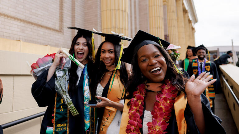 school of management graduates outside st.ignatius church