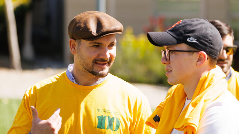 two people talking at Celebrate USF