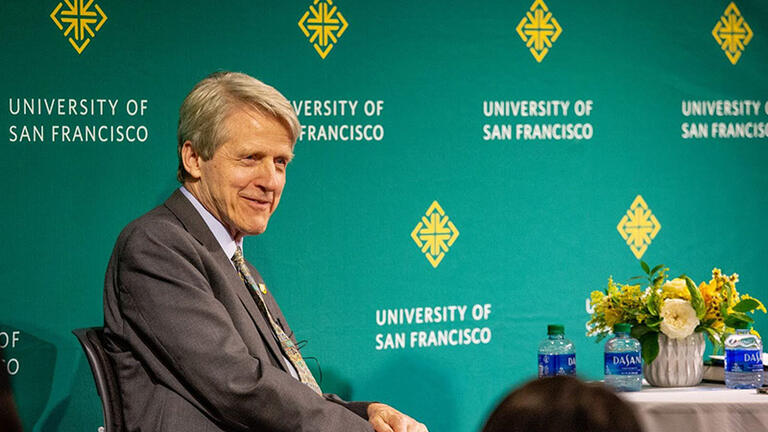 Robert Shiller sitting on stage