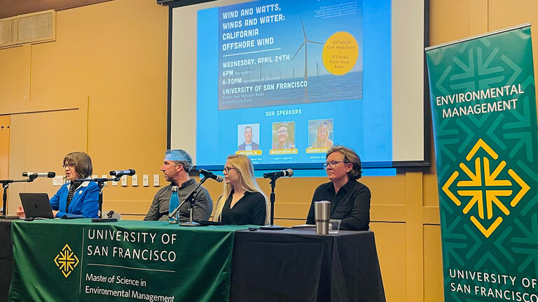 panel of speakers at a conference