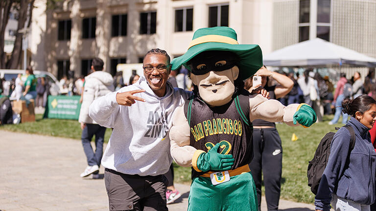 Student and USF mascot