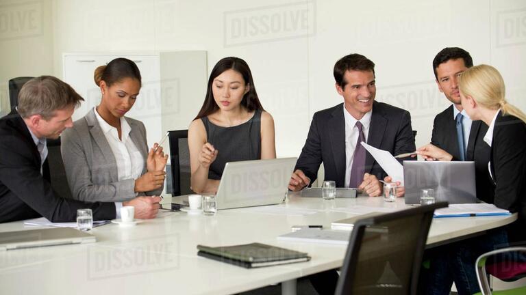 executive students sitting around a table