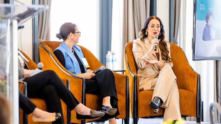 People speaking on a panel