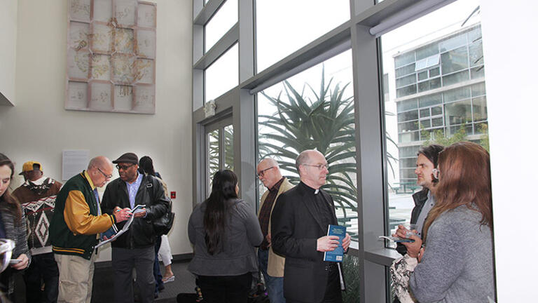 USF Malloy Hall atrium with people at reception