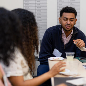 A guest speaking to a small group of students