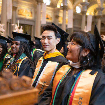 students sitting at saint ignatius church during commencement