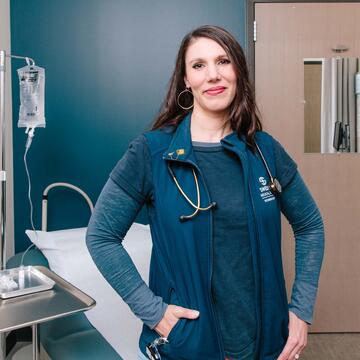 Nurse poses in a hospital room