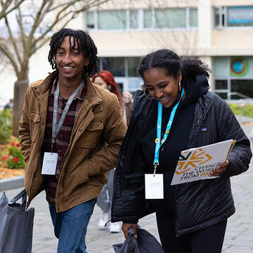 Two USF students walking together on campus