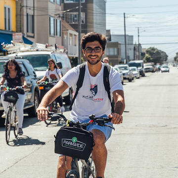 Student on bicycle.