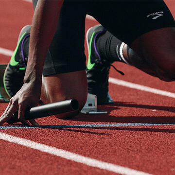 Track runner in starting position