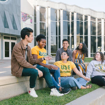 group of diverse students hanging out at gleeson plaza