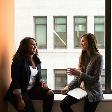 Two working professionals chatting