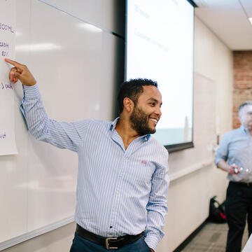 Person presenting to class.