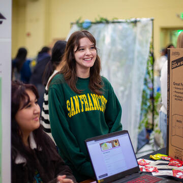 Student at involvement fair booth.