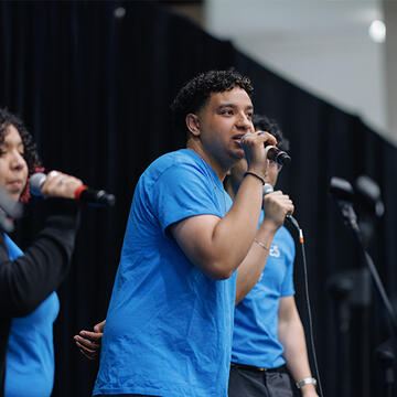 USF student singing on stage