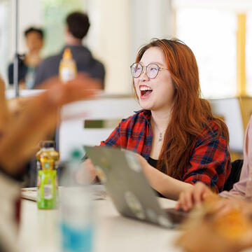 students laughs in cafeteria