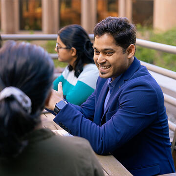 Adults smiling and chatting with each other