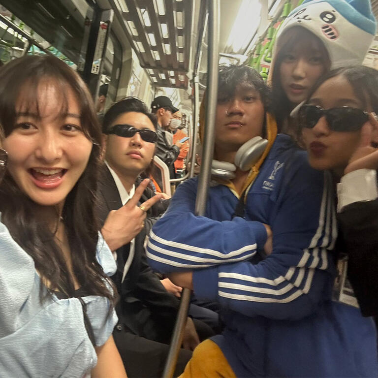 Students ride a crowded subway in Tokyo