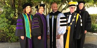 Pictured left to right: Lila Garlinghouse ‘22, Dean Susan Freiwald, Brendon Woods '96, University President Fr. Paul Fitzgerald, S.J., Associate Dean Amy Flynn '04