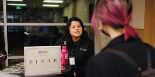 Diana Guardado talks with a student