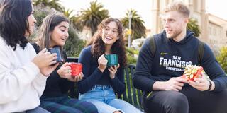 Students talking while sitting outside