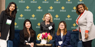 Attendees posing for a photo at the symposium